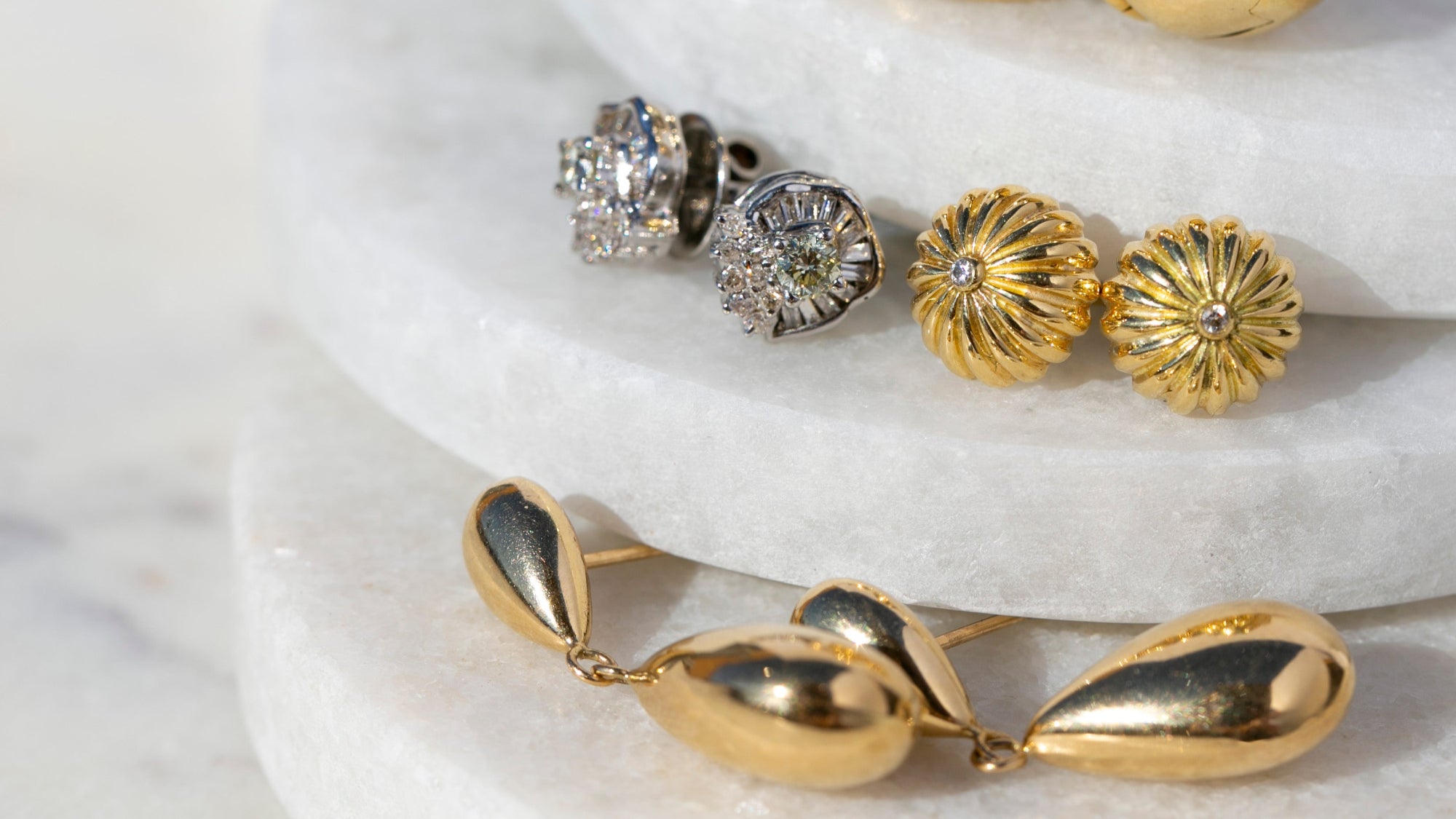 mid-century diamond earrings, retro gold and diamond studs, and gold almond drop earrings