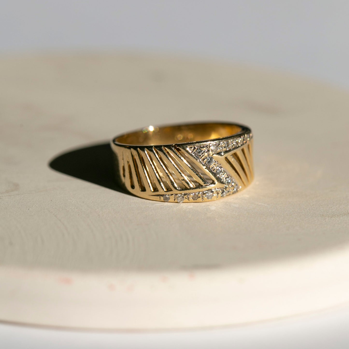 wide 14k yellow gold and diamond band featuring a Z-design